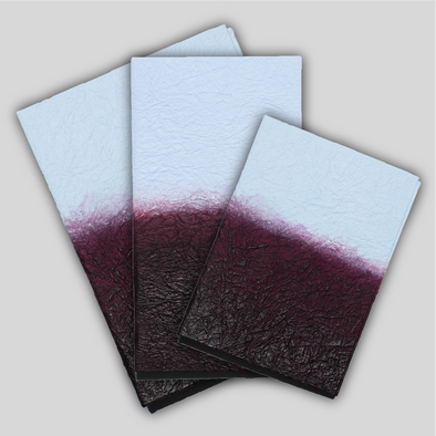 Angled shot of stacked burgundy and light blue Hanaduri Gugimfolios in 3 sizes