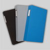 Fanned array of three ProFolio Photo Album Deluxes in blue, gray, and black