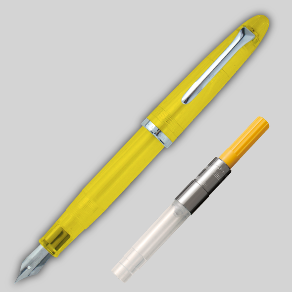 Yellow Sailor Compass 1911 Steel Fountain pen diagonally across page, showing matching color converter alongside.